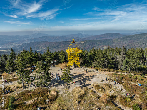 Fototapeta Naklejka Na Ścianę i Meble -  Aerial drone view of Ram Mountain.Observation tower on the top of the mountain. Autumn in the Beskid Mountains.Barania mountain domed  in Silesian Beskids. Barania hill  Ram Mountain nature reserve.