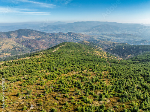 Aerial drone view of Ram Mountain.Observation tower on the top of the mountain. Autumn in the Beskid Mountains.Barania mountain domed  in Silesian Beskids. Barania hill  Ram Mountain nature reserve. photo