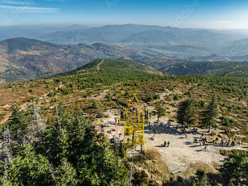 Aerial drone view of Ram Mountain.Observation tower on the top of the mountain. Autumn in the Beskid Mountains.Barania mountain domed  in Silesian Beskids. Barania hill  Ram Mountain nature reserve. photo