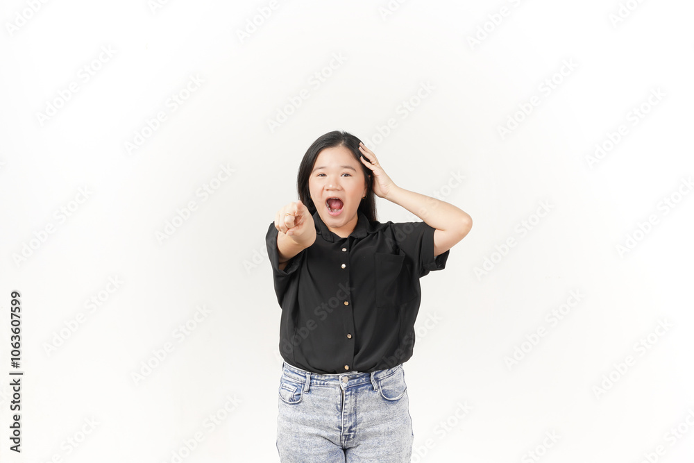 beautiful Asian woman shows a shocked expression, pointing outward while holding her head in surprise against a white background. beautiful Asian woman shows a shocked expression, pointing outward while holding her head in surprise against a white background.