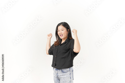 beautiful Asian woman displays a joyful expression, raising her hand in a celebratory gesture against a white background