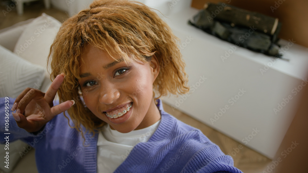 Smartphone web camera view mobile phone webcam young gen z girl posing smiling recording video channel influencer blogger streaming online blog vlog home couch African American woman make photo selfie Smartphone web camera view mobile phone webcam young gen z girl posing smiling recording video channel influencer blogger streaming online blog vlog home couch African American woman make photo selfie