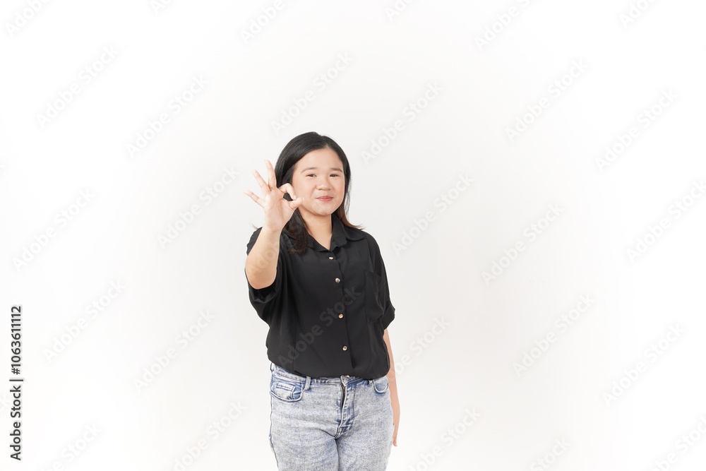 beautiful Asian woman smiles warmly while making an 'OK' hand gesture against a bright white background beautiful Asian woman smiles warmly while making an 'OK' hand gesture against a bright white background