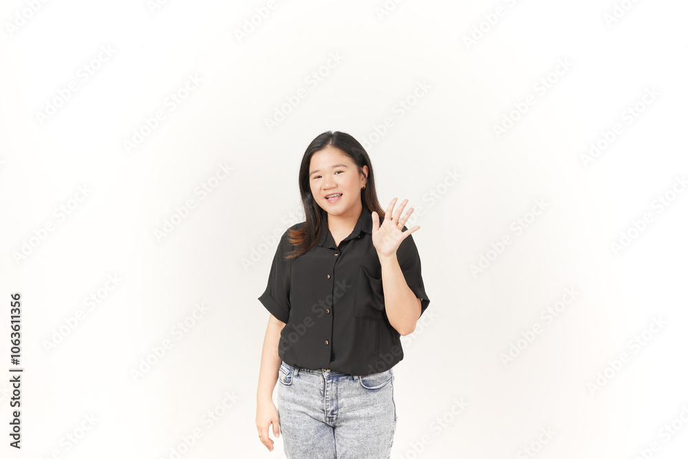 beautiful Asian woman smiles warmly while making a friendly 'hi' hand gesture against a white background beautiful Asian woman smiles warmly while making a friendly 'hi' hand gesture against a white background
