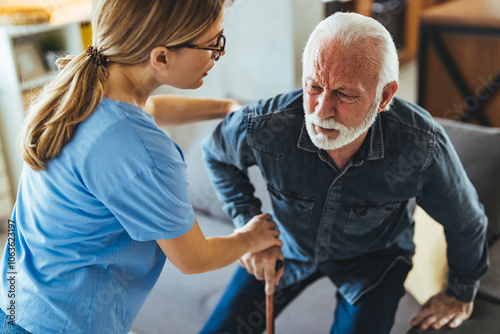 Elderly Man Assisted by Caregiver at Home