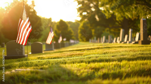 Morning sunlight illuminates a u.s. military cemetery. american flags adorn headstones, symbolizing respect and remembrance for those who served their country. photo