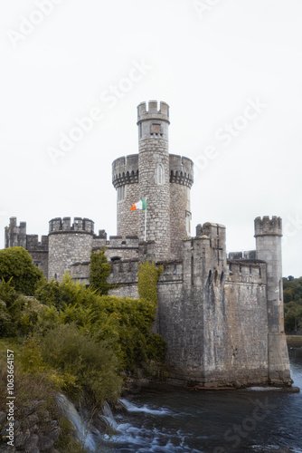 Old castle in the country with an Irish flag