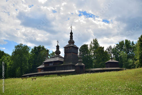 Obraz na płótnie Detail of the roof of the wooden church and 3 metal crosses in a row w salonie