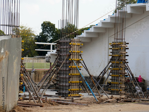 New construction site with beam frame to prepare reinforced concrete columns, foundation work and concrete pouring. Construction industry.