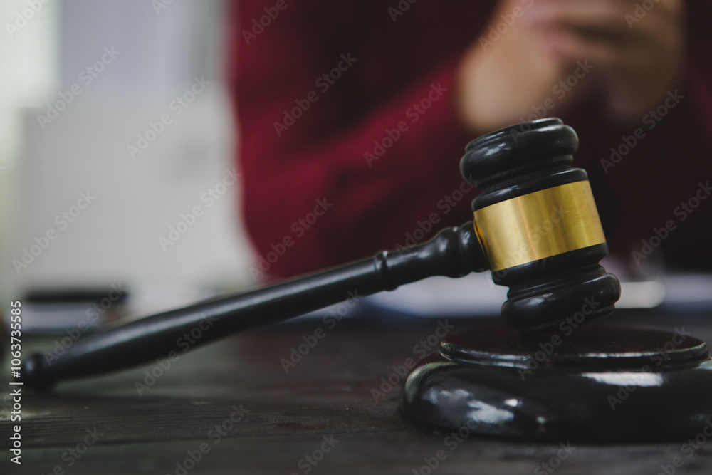 An Asian male lawyer meticulously reviews legal documents, ensuring accuracy and compliance for an upcoming court case. He highlights key points and prepares strategies to effectively An Asian male lawyer meticulously reviews legal documents, ensuring accuracy and compliance for an upcoming court case. He highlights key points and prepares strategies to effectively