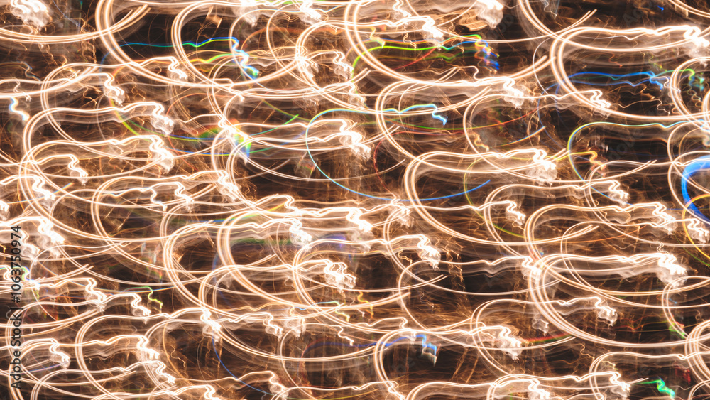The image is a blurry, colorful, and abstract representation of a pattern of lights. The pattern is made up of many different shapes and colors, creating a sense of movement and energy The image is a blurry, colorful, and abstract representation of a pattern of lights. The pattern is made up of many different shapes and colors, creating a sense of movement and energy