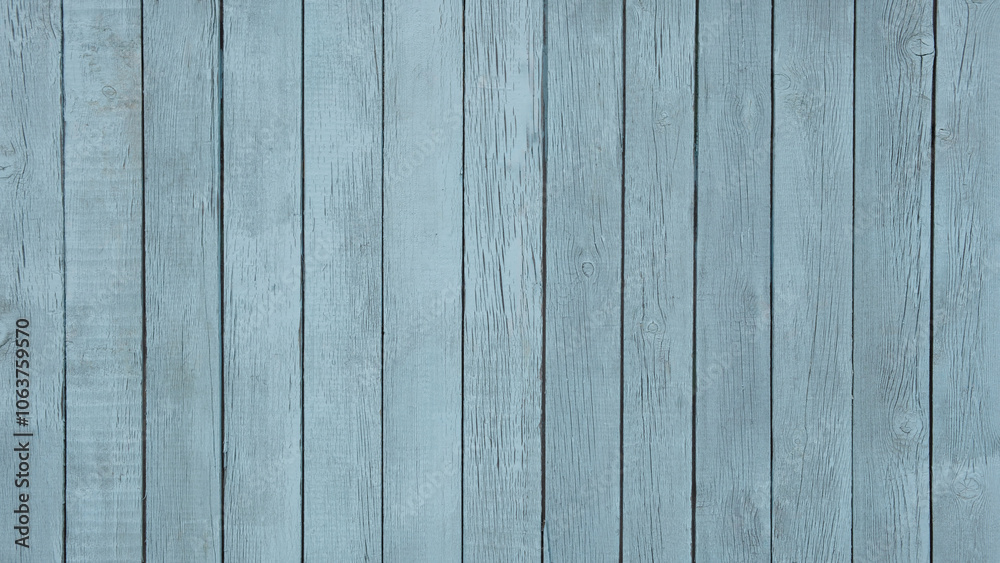 Fototapeta premium A blue wooden board with a few scratches and dents. The board is long and narrow, and it is made of wood