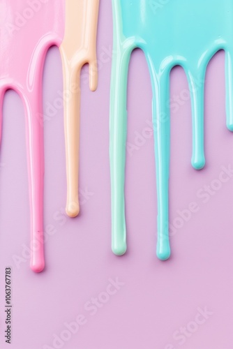 Pastel colored paint dripping - abstract art in soft hues