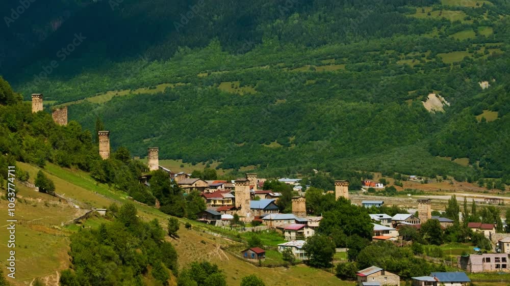 Ushguli, Georgia. An aerial view of a hidden in the mountains ancient Ushguli, Georgia during a sunny summer day. Time-lapse during the day Ushguli, Georgia. An aerial view of a hidden in the mountains ancient Ushguli, Georgia during a sunny summer day. Time-lapse during the day