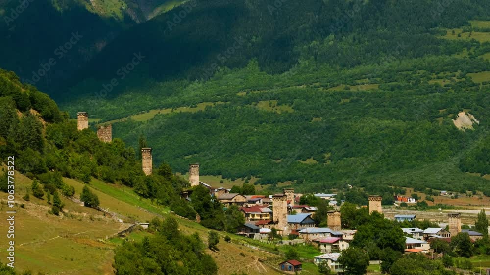 Ushguli, Georgia. An aerial view of a hidden in the mountains ancient Ushguli, Georgia during a sunny summer day. Time-lapse during the day, zoom in Ushguli, Georgia. An aerial view of a hidden in the mountains ancient Ushguli, Georgia during a sunny summer day. Time-lapse during the day, zoom in