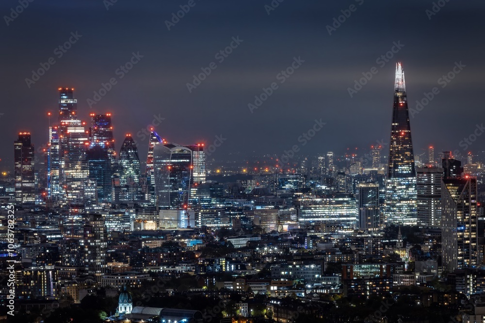 Elevated night view of the illuminated city skyline of London, England Elevated night view of the illuminated city skyline of London, England