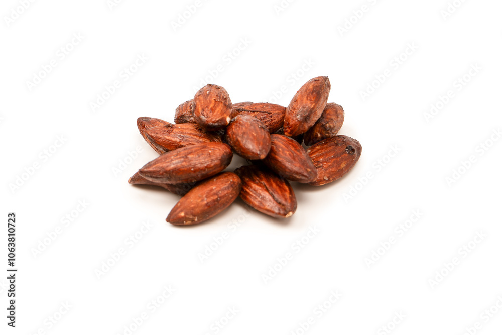 A group of caramelized almonds isolated on a white background. A group of caramelized almonds isolated on a white background.