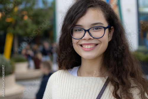 White girl with glasses smiling