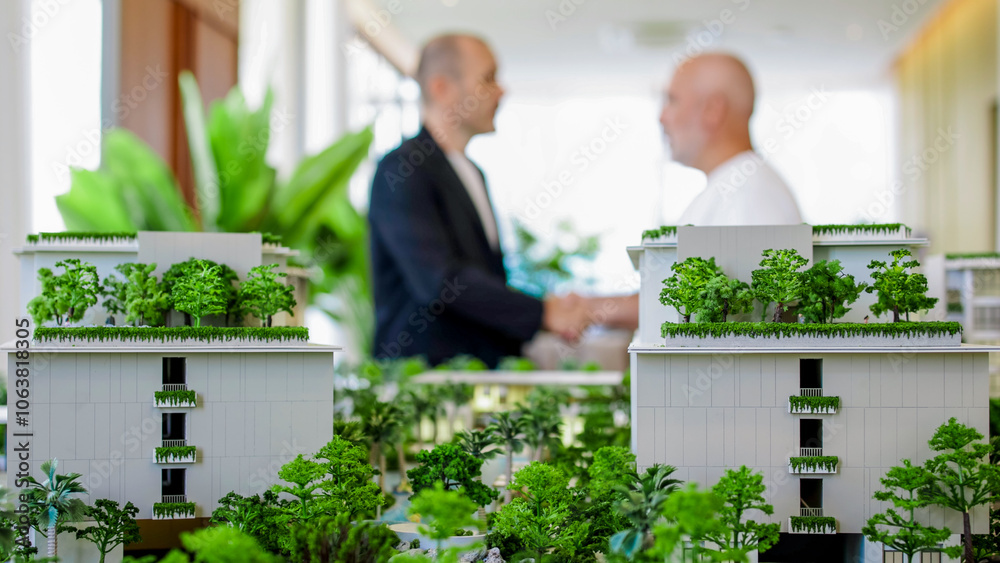 An agent finalizes a real estate purchase with a client, shaking hands in a professional setting. This moment captures the trust and satisfaction in successful property transactions. An agent finalizes a real estate purchase with a client, shaking hands in a professional setting. This moment captures the trust and satisfaction in successful property transactions.