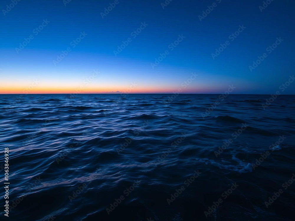 Obraz premium A stunning sunset view of the vast and tranquil ocean filled with vibrant colors reflecting in the water, creating a sense of peace and serenity, waves, serenity