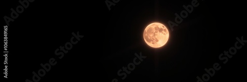 A striking image of a red blood moon shining brightly against a dark night sky, lighting, unworldly photo