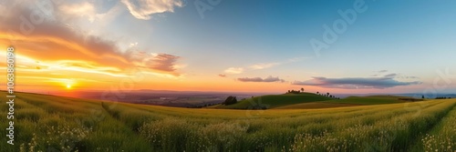 A peaceful sunset over a tranquil meadow, with rolling hills and a clear sky, rural, environment
