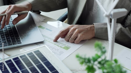 Business eco Alternative, sustainable electricity, people creating ideas working on green energy in eco friendly office
