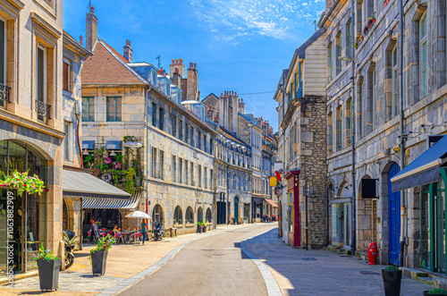 Fototapeta Naklejka Na Ścianę i Meble -  Typical street Rue des Granges in Besancon old town, Besançon city historic centre with old houses medieval buildings, terraced cafe in sunny summer day, Bourgogne-Franche-Comte region, France