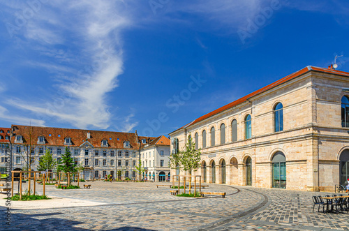 Place de la Revolution square, Museum of Fine Arts and Archeology building and green trees in Besancon old town centre ville, Besançon city historic centre, Bourgogne-Franche-Comte region, France photo