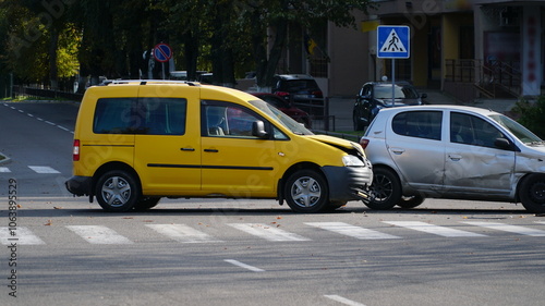 Traffic accident. Wrecked car. Car crash accident on street, damaged automobiles after collision in city. n