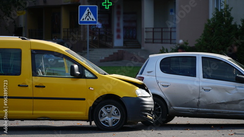 Traffic accident. Wrecked car. Car crash accident on street, damaged automobiles after collision in city. n