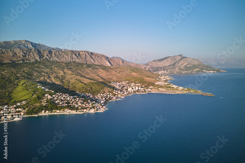 Aerial view of the Croatian littoral from village Dugi Rat towards town Omis in summertime