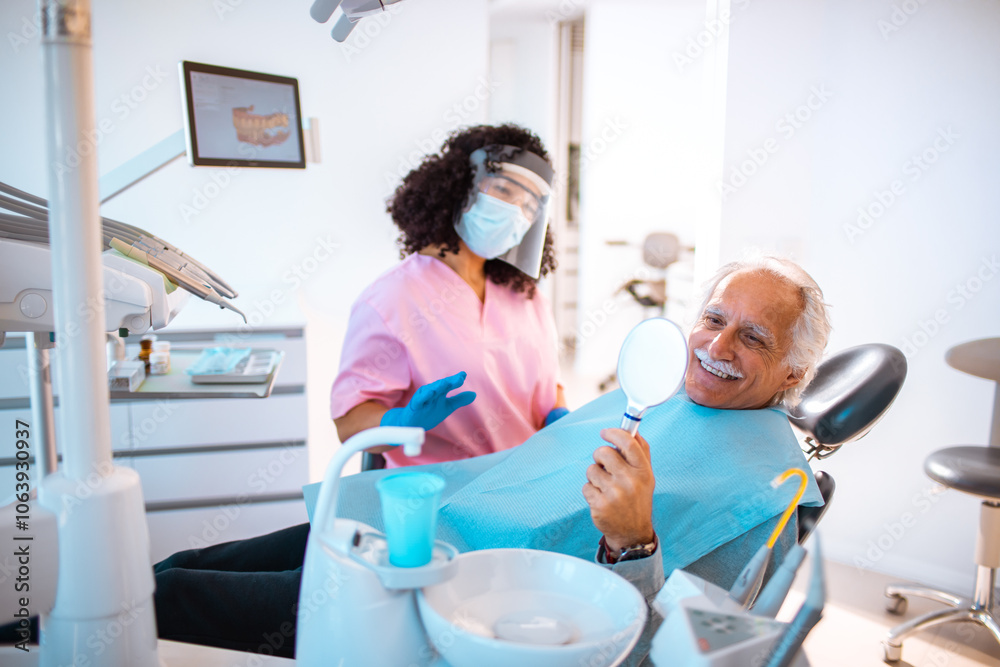 Female dentist working on a senior patient teeth in her dental office Female dentist working on a senior patient teeth in her dental office