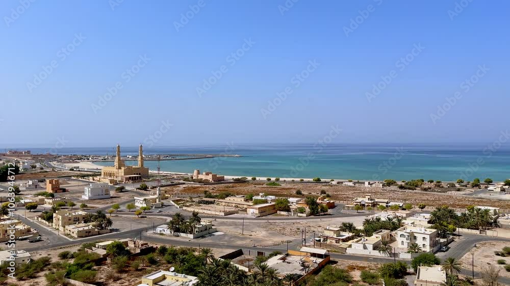 coastal view of Bukha city with traditional architecture and a mosque, Musandam, Oman coastal view of Bukha city with traditional architecture and a mosque, Musandam, Oman