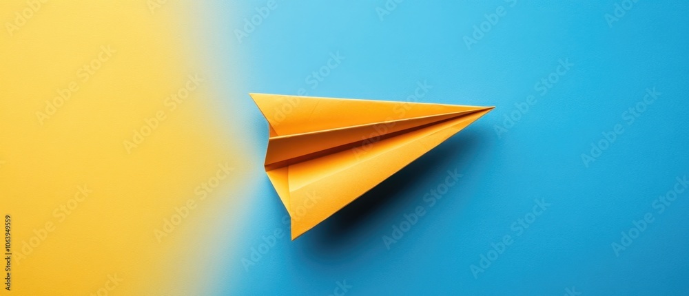 A vibrant yellow paper airplane soaring on a blue and yellow background with a smooth gradient, symbolizing creativity and imagination A vibrant yellow paper airplane soaring on a blue and yellow background with a smooth gradient, symbolizing creativity and imagination