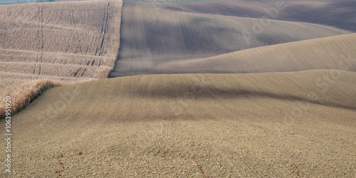 Stunning undulating arable agricultural landscape, photographed in autumn in south Moravia in the Czech Republic. The area is known as Moravian Tuscany and is full of rolling hills used for farming. photo