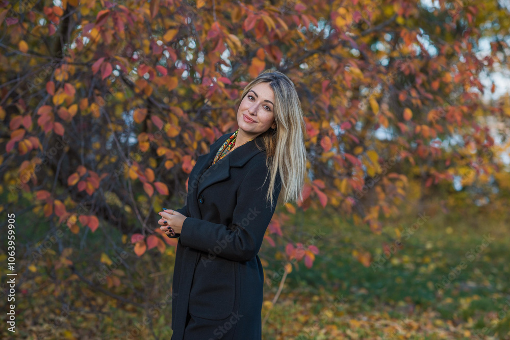 Blonde hair lady in black wool coat and golden scarf, fashionable trends for women, real photo outdoor portrait