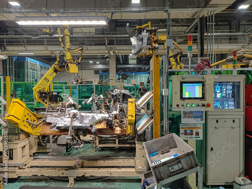 Production assembly line on which car body parts are produced in an automotive factory