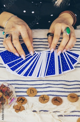 A fortune teller reads with tarot cards. Selective focus. photo