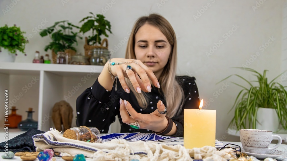A fortune teller reads with tarot cards. Selective focus. A fortune teller reads with tarot cards. Selective focus.