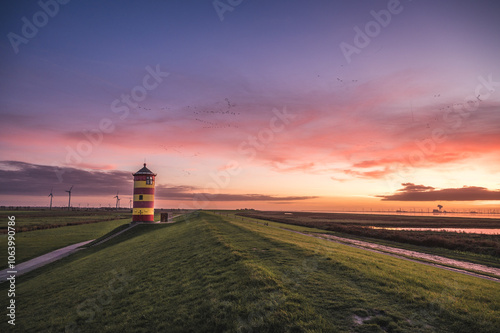 Der Pilsumer Leuchtturm bei Sonnenuntergang photo