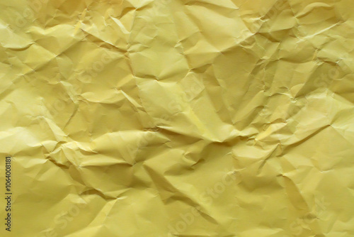 Crumpled yellow paper as background