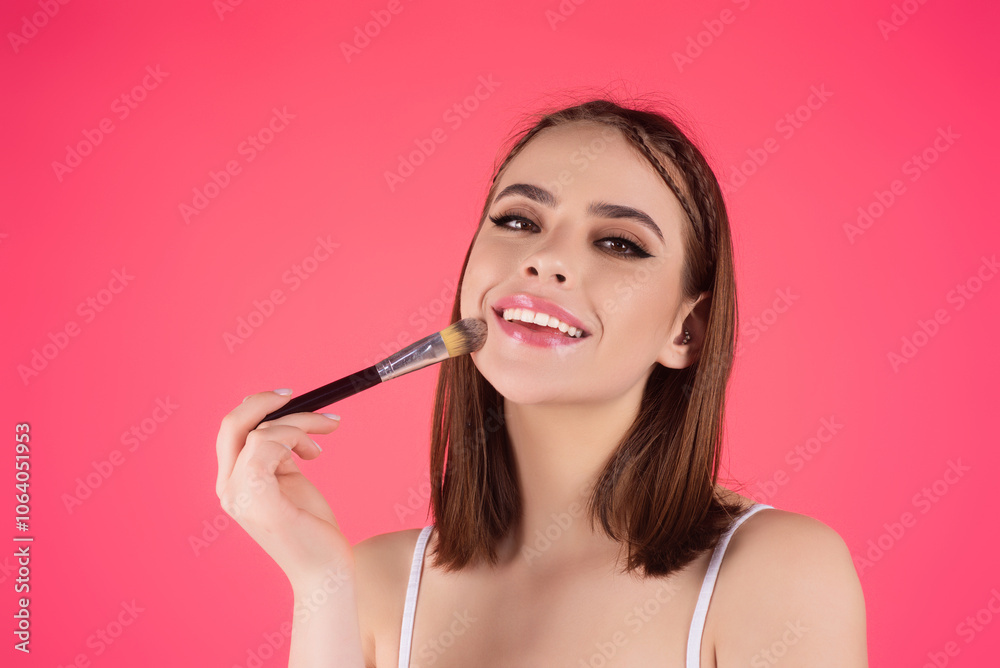 Woman applying foundation powder or blush with makeup brush. Facial treatment, perfect skin, natural make up, facial beauty. Isolated on studio background. Applying makeup. Woman applying foundation powder or blush with makeup brush. Facial treatment, perfect skin, natural make up, facial beauty. Isolated on studio background. Applying makeup.