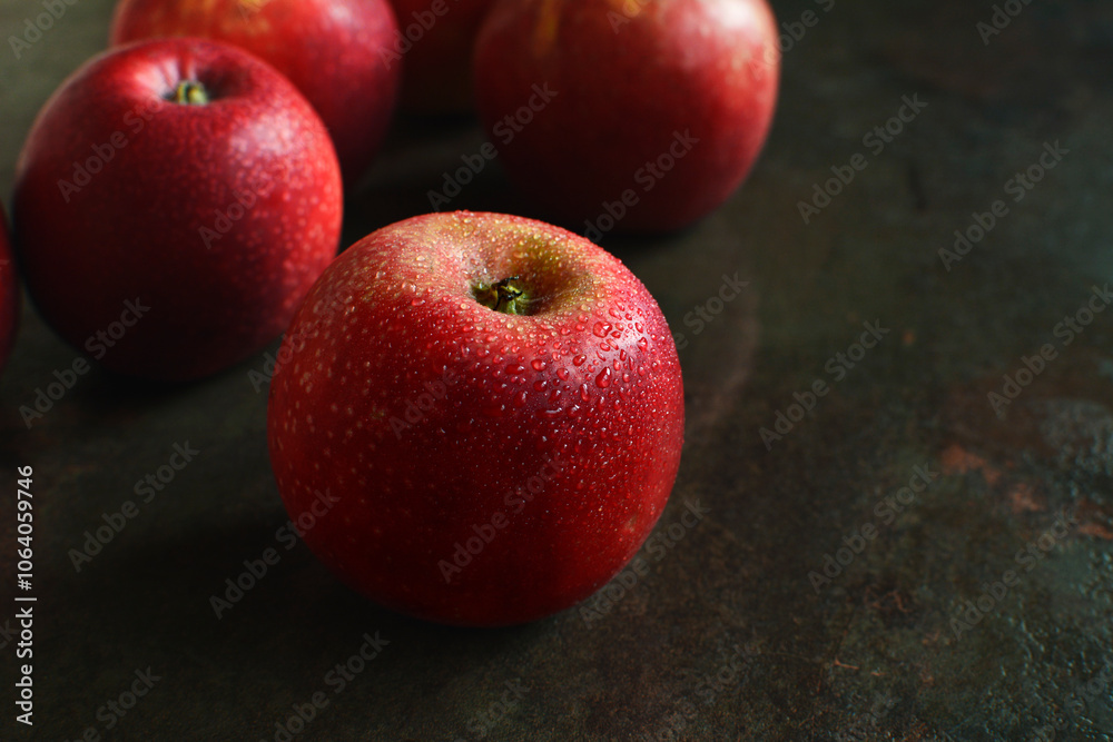 Fresh wet red apples on dark background Fresh wet red apples on dark background