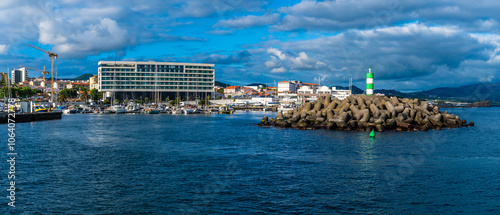 A view across the inner harbor and harbor wall in Ponta Delgada in the Azores in summertime