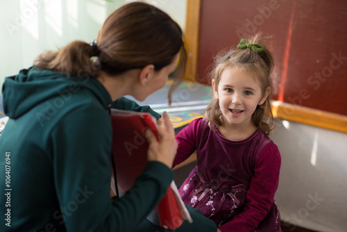 little girl in the speech therapist's office. session with a speech therapist for a child photo