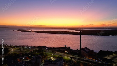 Gasometro Factory At Porto Alegre In Rio Grande Do Sul Brazil. Guaiba Lake Landscape. Landmark Building. Sunset City Skyline. Gasometro Factory At Porto Alegre In Rio Grande Do Sul Brazil. 