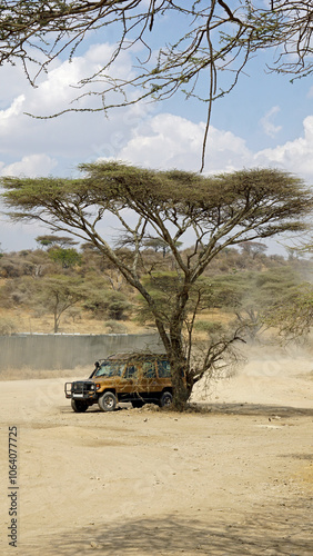 safari truck in the serengeti in tanzania photo