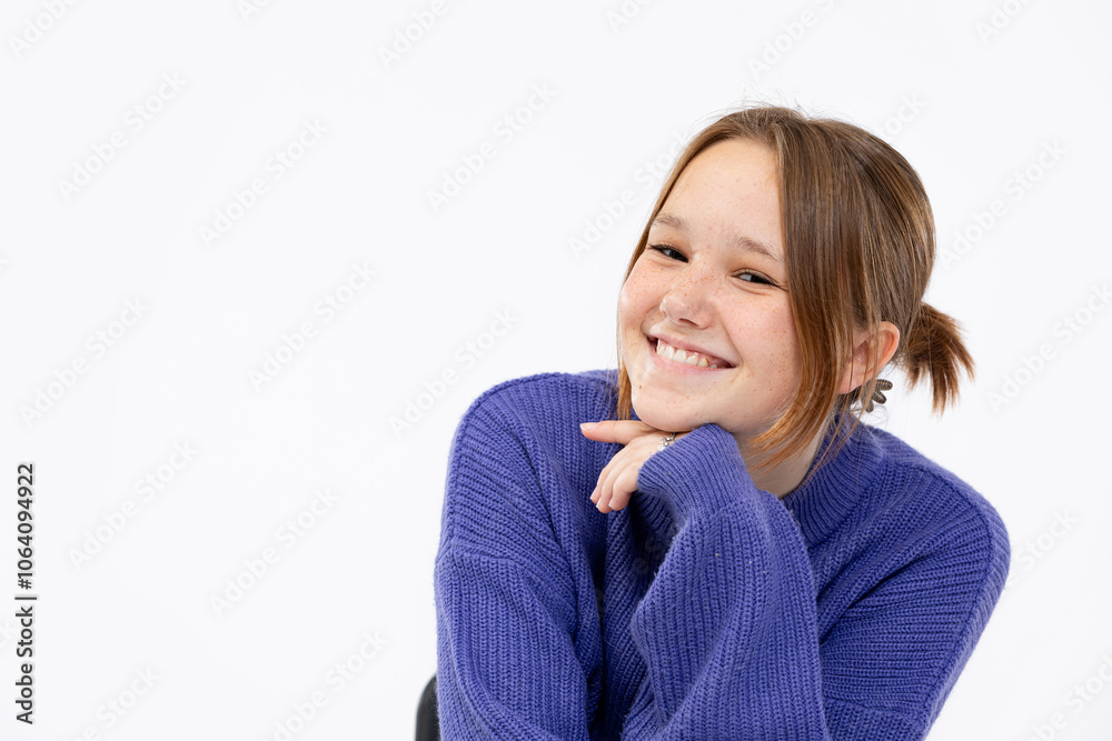 A Cheerful Young Girl Wearing a Cozy Sweater and Smiling Brightly with Joyful Energy A Cheerful Young Girl Wearing a Cozy Sweater and Smiling Brightly with Joyful Energy