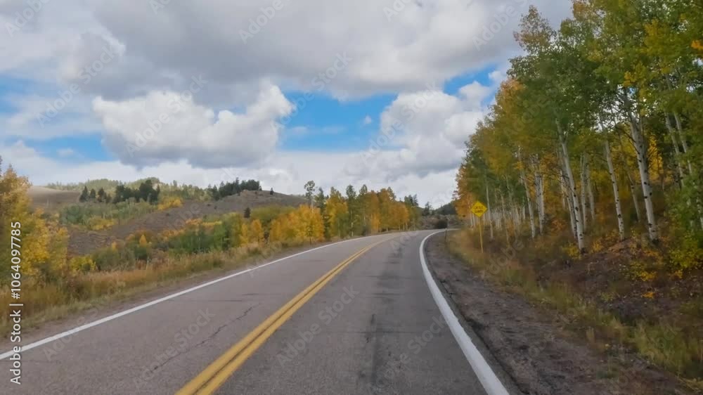 Immersive driver's point of view journey through mountains at peak fall foliage from Steamboat Springs to Yampa, Colorado. Immersive driver's point of view journey through mountains at peak fall foliage from Steamboat Springs to Yampa, Colorado.